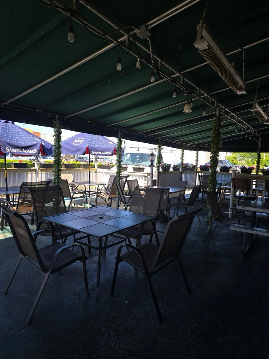 Patio seating under the green awning